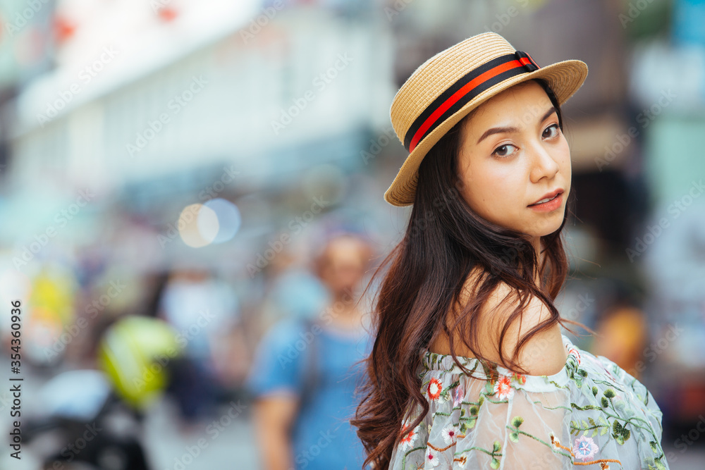 Young beautiful woman walking on city streets on a sunny day of summer Young beautiful woman walking on city streets on a sunny day of summer