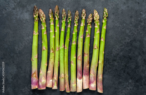 
Raw green asparagus on a stone background 