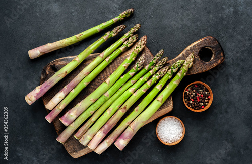 
Raw green asparagus on a stone background 