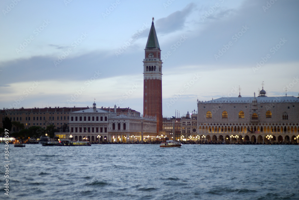 View of Campanile of St. Mark's Cathedral from the Grand Canal, Venice, Italy. Campanile of St. Mark's Cathedral in the evening.