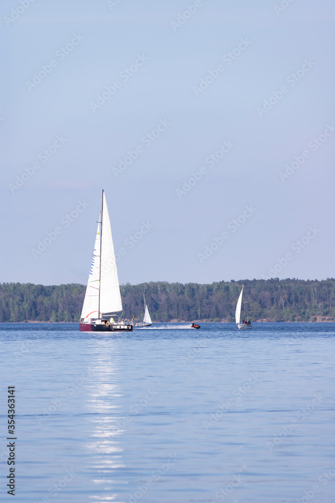 Small sailing boats in Kaunas Reservoir, the largest Lithuanian artificial lake.