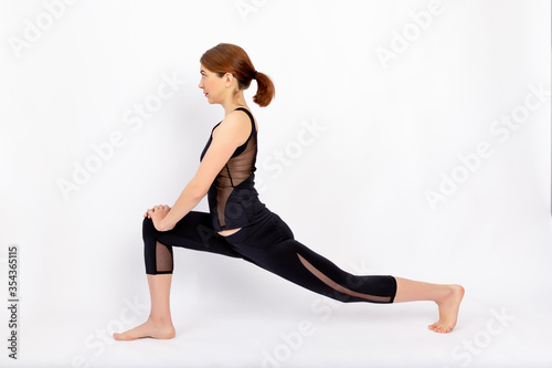 girl doing stretching on a white background, healthy lifestyle, weight loss, sports, space for text