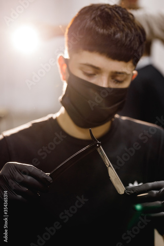 dangerous blade on the background of the master barbershop