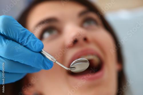 Close up of dentist that doing teeth checkup