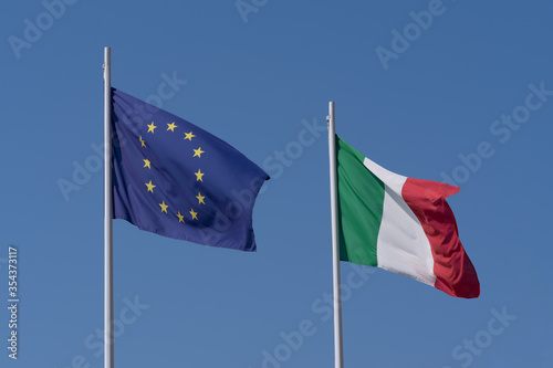 European Union and Italian flags waving