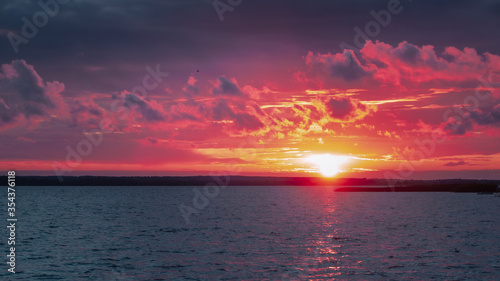 red clouds over the lake at sunset