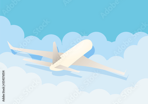 Avión blanco surcando los cielos a través de nubes. 