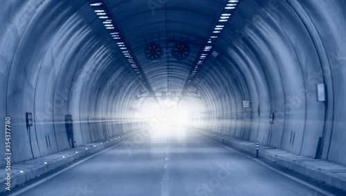 Highway road tunnel with car light  © muratart