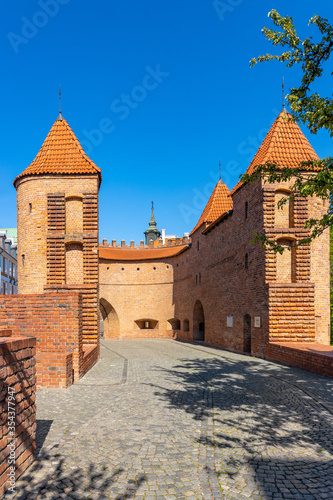 Warsaw Barbican fortified outpost as part of brick and stone historic defence walls in Stare Miasto Old Town quarter of Warsaw, Poland photo