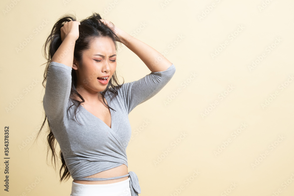 Stressed young Asian businesswoman scream out. Stressed young Asian businesswoman scream out.