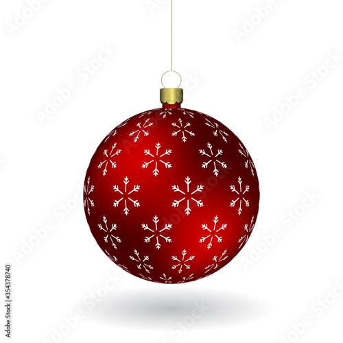 Red Christmass ball with snowflakes print hanging on a golden chain