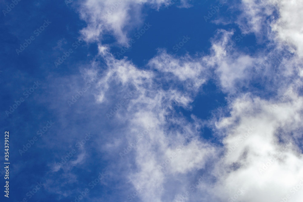 Fototapeta premium Light cumulus clouds in the blue sky