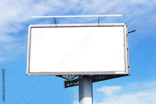Blank billboard background. Cloudy blue sky advertisment texture. Empty copy space poster signpost panel. Street banner by the road.
