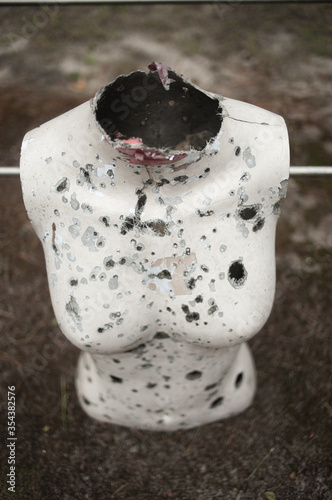 Rifle range with manequins covered with bullet holes photo