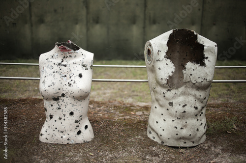 Rifle range with manequins covered with bullet holes photo