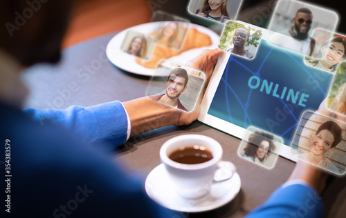 Guy using tablet with online services functional web icons