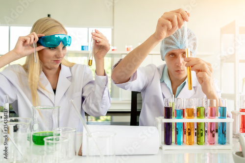 Scientist Test Droplet of Chemical Samples in Tubes in a Research Laboratory.