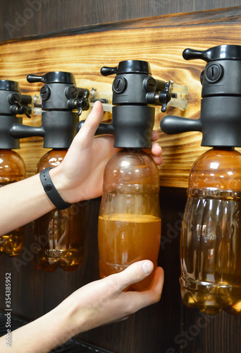 Bartender pours beer through antifoam photo