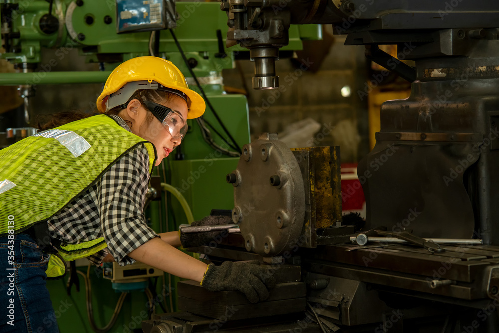 Female technician working on project in a factory,Industrial building concept. Female technician working on project in a factory,Industrial building concept.