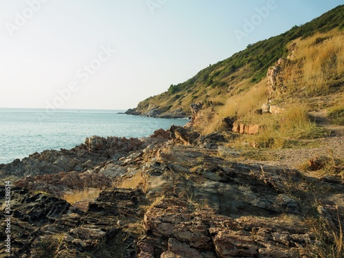 View of the moutain grass and sea in good weather day.