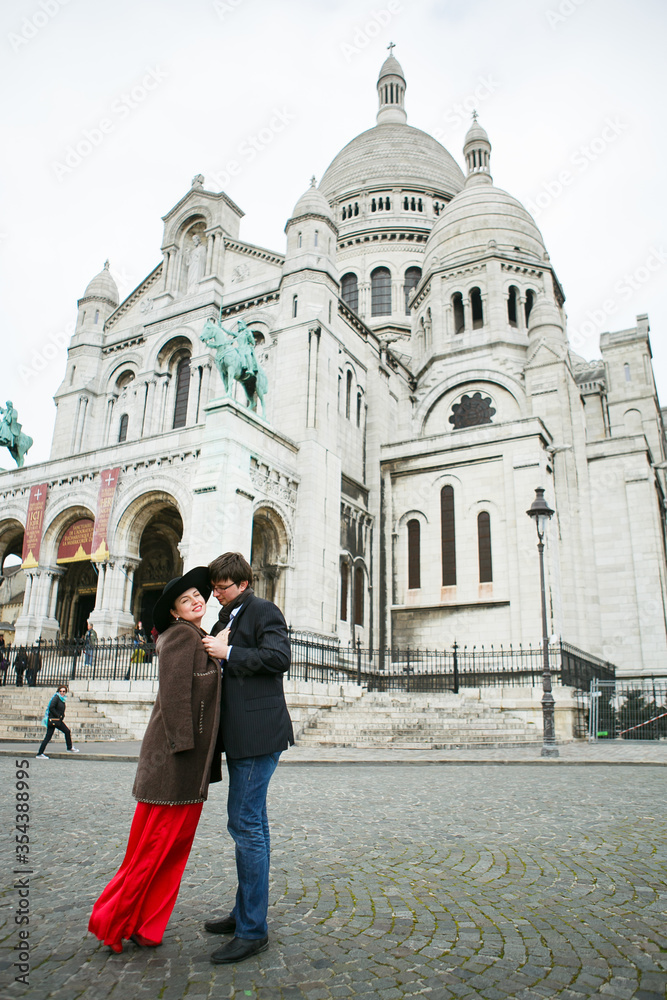 couple in love walks on Montmartre hill in Paris. man and woman in France.