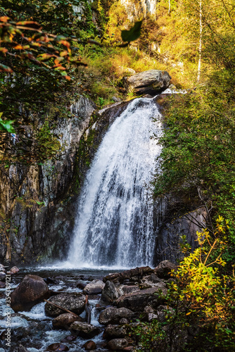 Waterfall in the autumn mountain forest. Russia  Altai Republic  Turochaksky district  Korbu waterfall