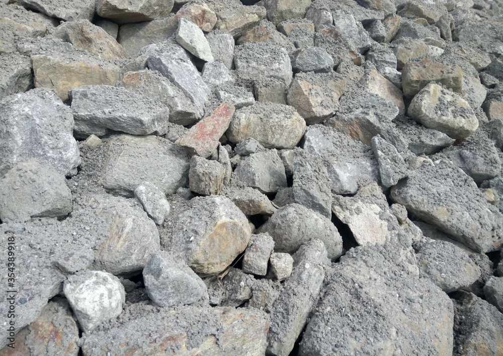 pile of stones strewn with sand