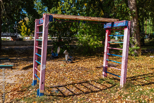 Equipment of the old playground in the autumn city park. Photo taken in the city of Barnaul. Russia
