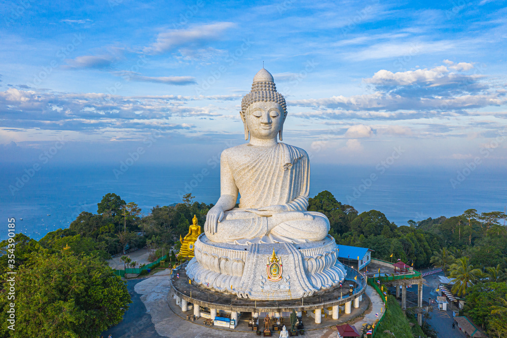 aerial view blue sky and blue ocean are on the back of Phuket Big Buddha statue..white Phuket big Buddha is the one of landmarks on Phuket island.. aerial view blue sky and blue ocean are on the back of Phuket Big Buddha statue..white Phuket big Buddha is the one of landmarks on Phuket island..