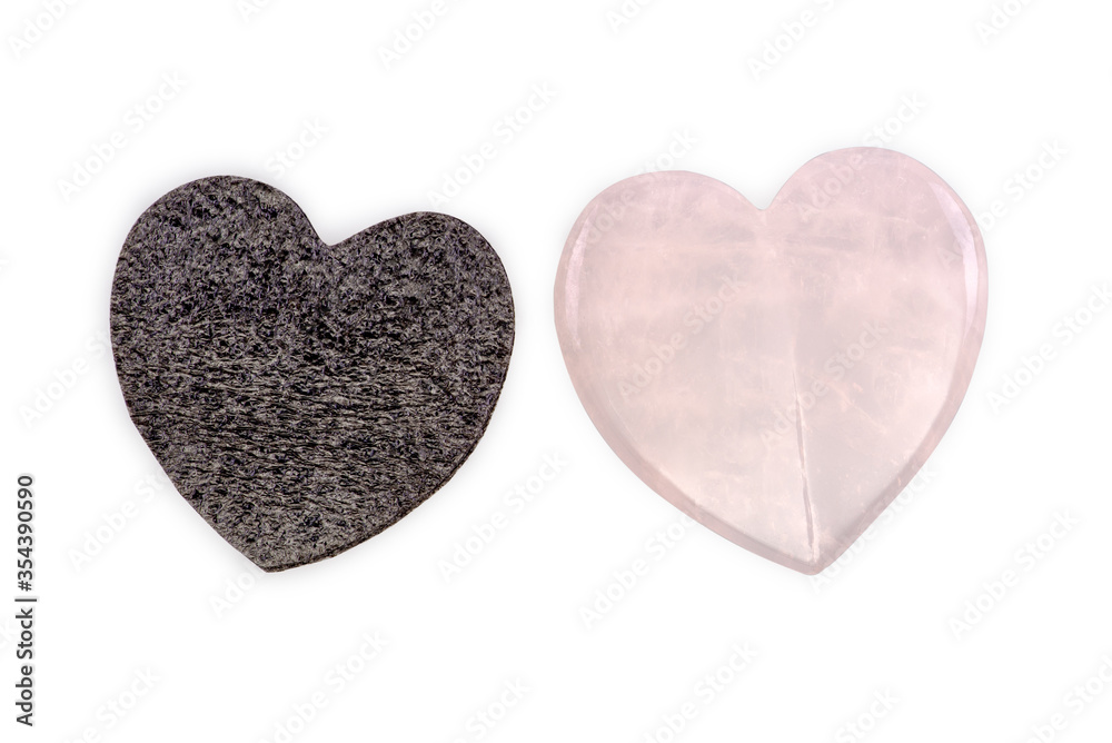 Rose quartz heart and black foam heart isolated on white background Rose quartz heart and black foam heart isolated on white background