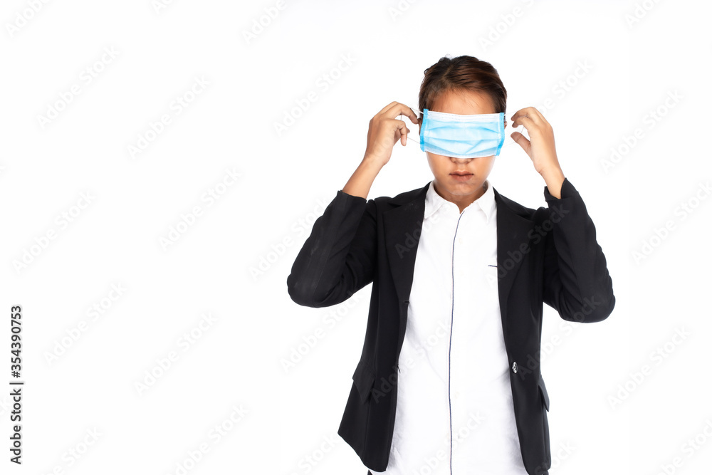 Asian businesswoman wearing surgical face mask on her eyes in formal black suit jacket, looking at camera, studio lighting isolated on white background, coronavirus, COVID19 concept