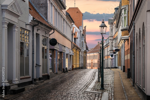 A beautiful colorful street at sunset in Viborg, Denmark. Beautiful city street in Denmark. Denmark cityscape at dusk. Scandinavian street at sunset. Viborg is one of the oldest cities in Denmark