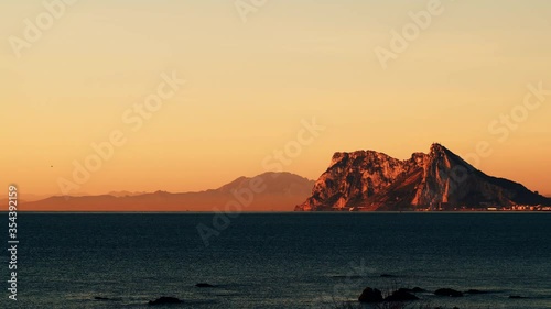 Seascape with Gibraltar rock, morning time, sunrise light. View from Torrecarbonera beach, Punta Mala, Andalusia Spain. Tourist attraction