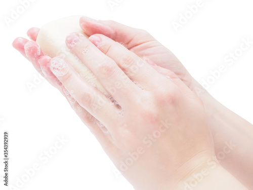 Soap hands holding a bar of soap  close-up  isolate on a white background. Antibacterial disinfectant soap  as a means of protection from germs. The doctor washes his hands before surgery