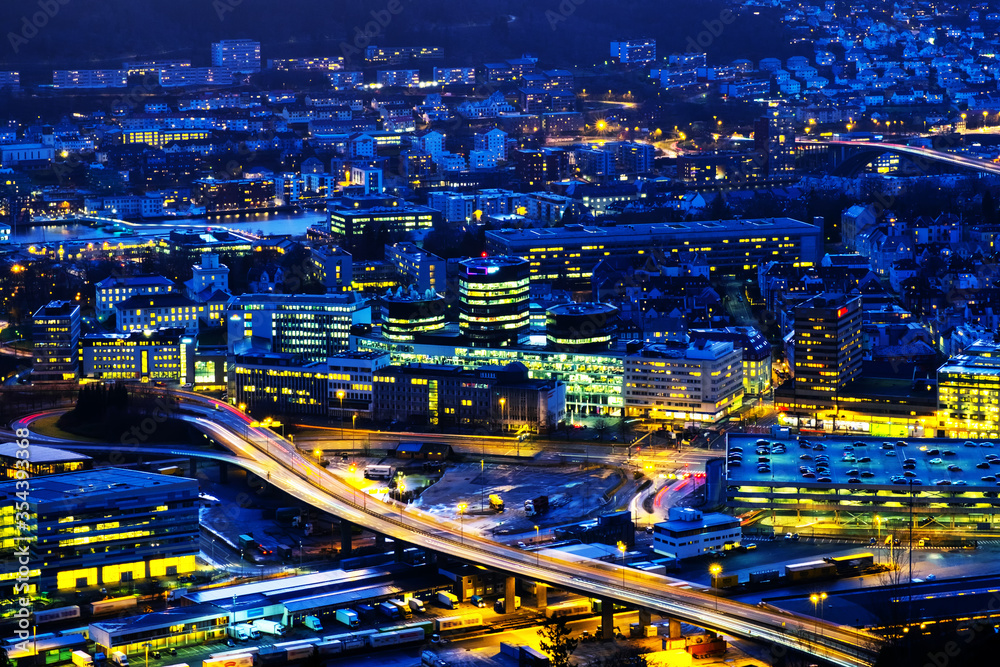Fototapeta premium Aerial view of Bergen, Norway at night. Illuminated roads and car traffic