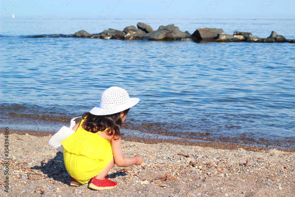 child playing in the beach.kid having fun outdoors .summer vacation and healthy lifestyle child playing in the beach.kid having fun outdoors .summer vacation and healthy lifestyle