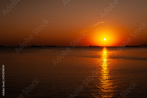 A sunset over a body of water © dimm86