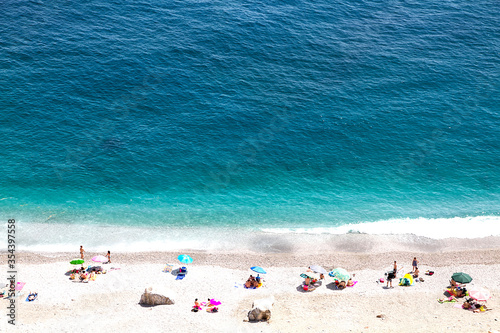 Fototapeta Naklejka Na Ścianę i Meble -  summer vacation holidays, aerial view of people sunbathing on the beach