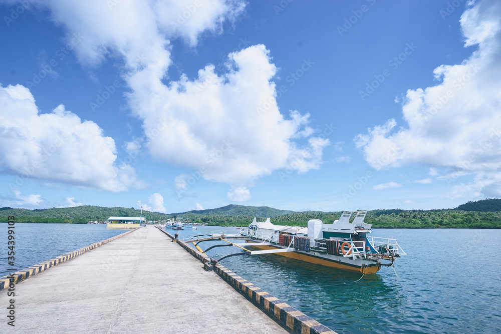 Travel by Philippines. Beautiful summer landscape with tropical sea shore and pier.