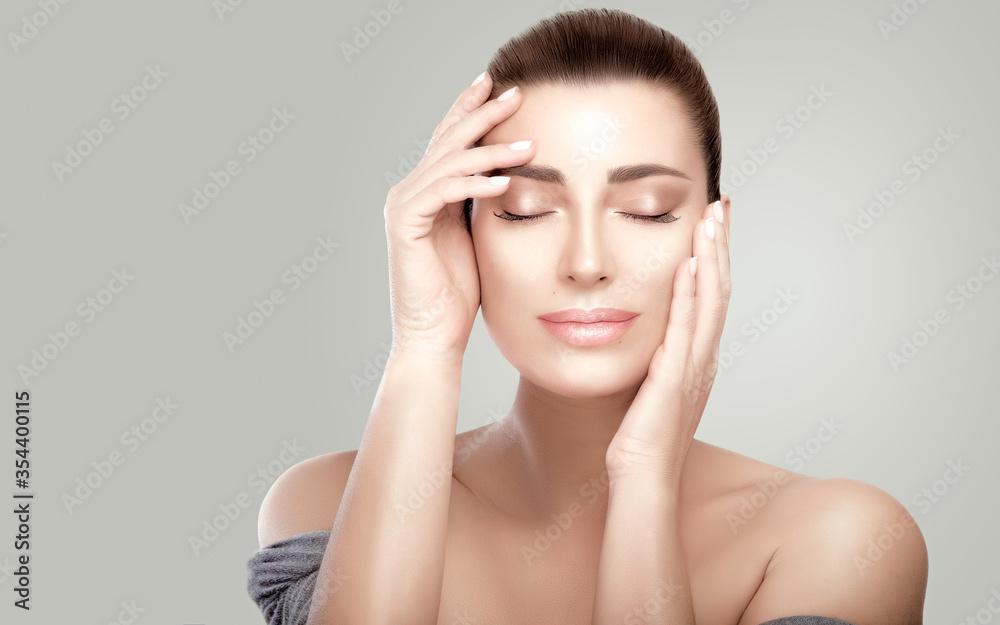 Beautiful serene woman with fresh clean skin. Heathy skin girl aplying facial treatment. Skincare concept Beautiful serene woman with fresh clean skin. Heathy skin girl aplying facial treatment. Skincare concept