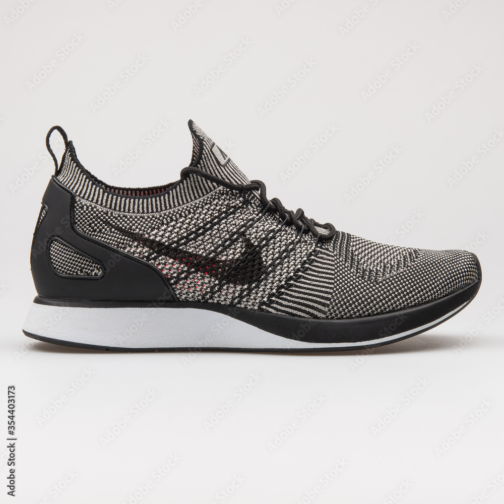 VIENNA, AUSTRIA - AUGUST 16, 2017: Nike Air Zoom Mariah Flyknit Racer black  and grey sneaker on white background. Stock Photo | Adobe Stock