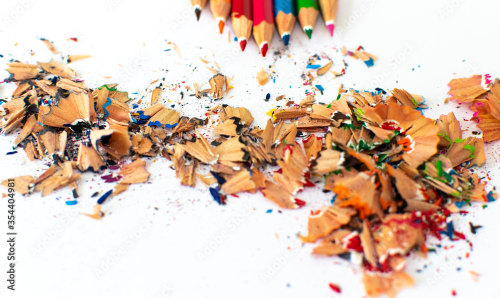 top colored pencils and scraps on a white background top colored pencils and scraps on a white background