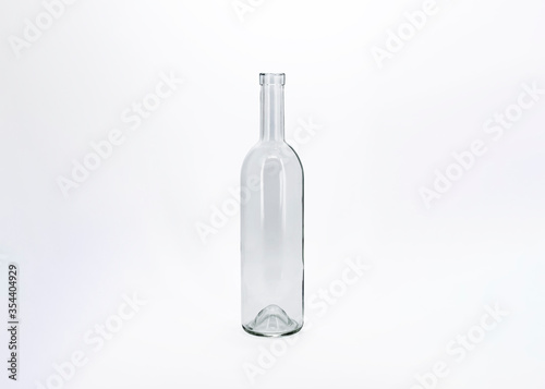 Empty glass bottle isolated on a white background.Can be used for your design and branding.High resolution photo.Mock-Up