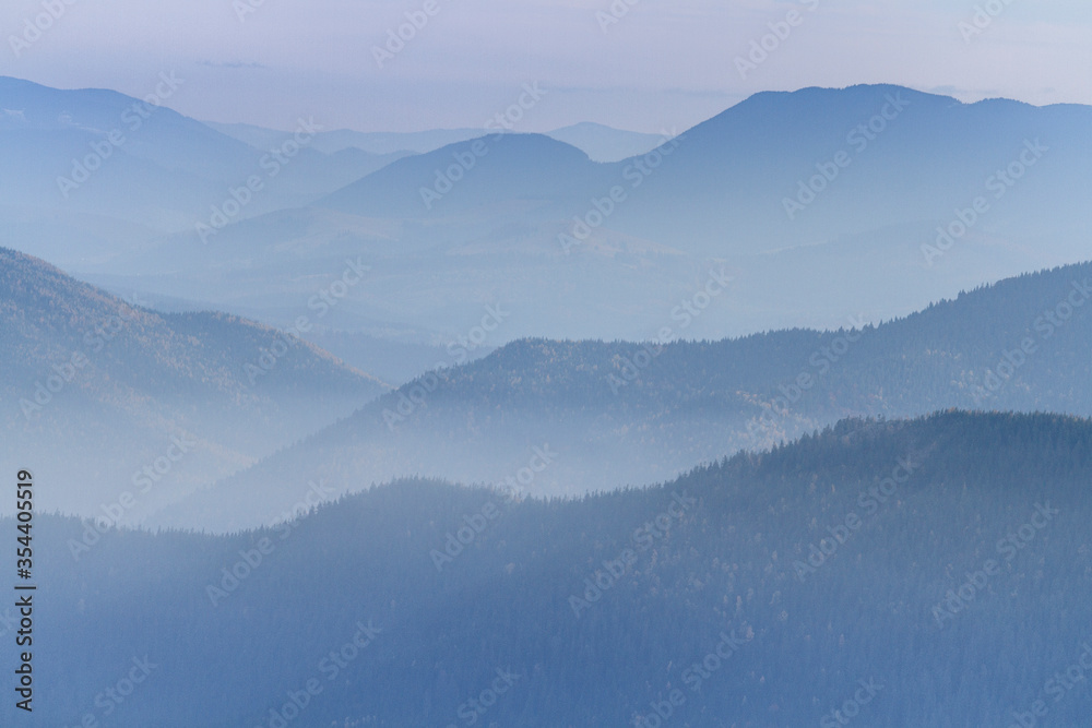 Mountain forest in the fog. Hiking travel outdoor concept panoramic view. Ukrainian Carpathian Mountains, Ukraine Mountain forest in the fog. Hiking travel outdoor concept panoramic view. Ukrainian Carpathian Mountains, Ukraine