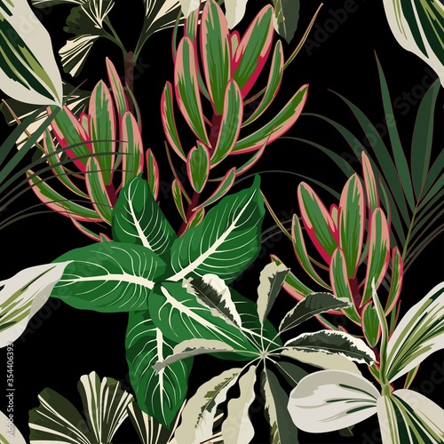 Tropical seamless pattern with bright exotic palm leaves and plants on black background.