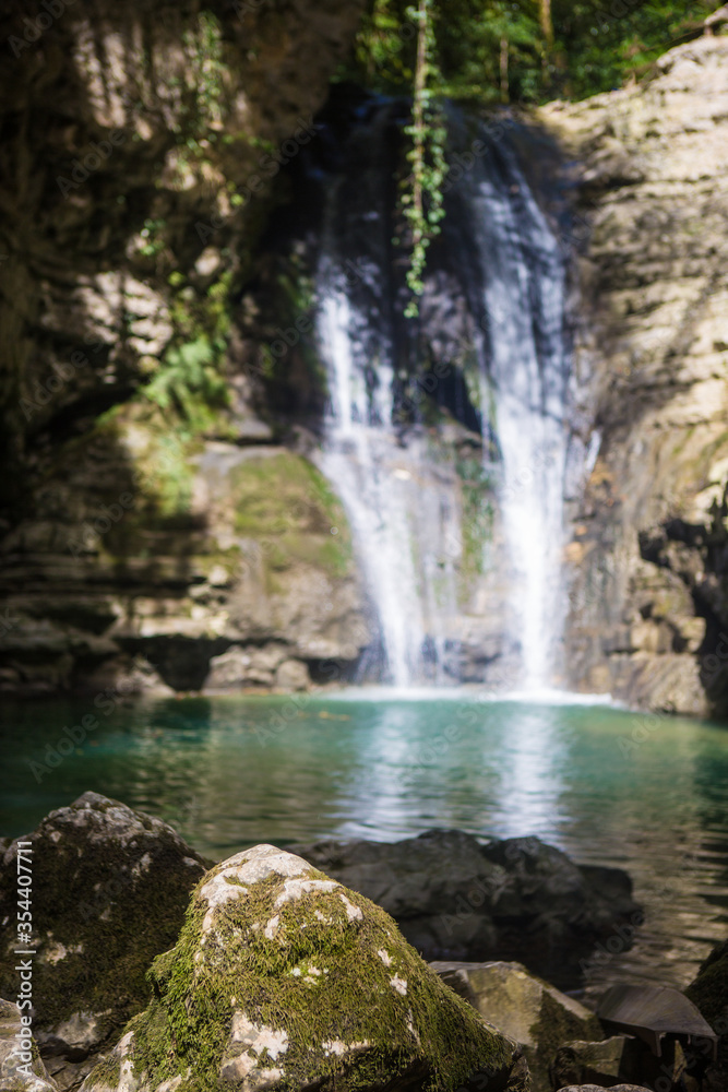 blue mountain river with a waterfall