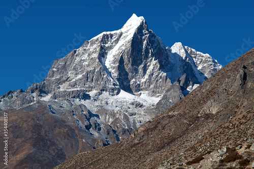 Taboche peak and Cholatse - beautiful Himalayan mountains around the way to Everest base camp  Everest area  Khumbu valley  Sagarmatha National Park  Nepal Himalayas