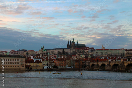 Postacard of the Historical city Prague, Czech Republic. The photo was taken at sunset time and it show the most iconic monuments of this european city.