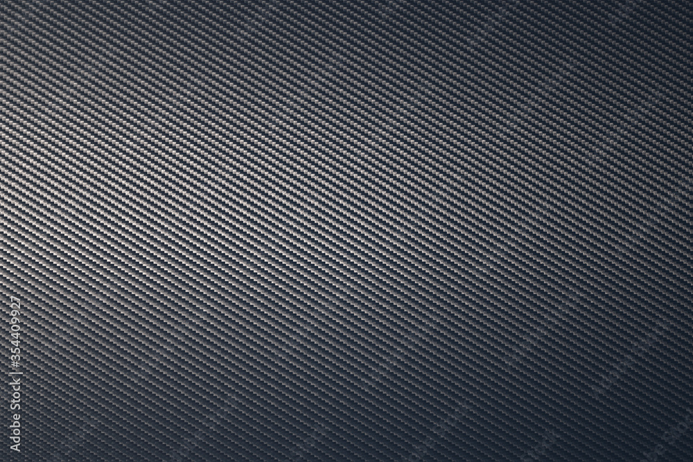 Close up of grey diagonal oriented woven carbon fibre sheet surface. Close up of grey diagonal oriented woven carbon fibre sheet surface.