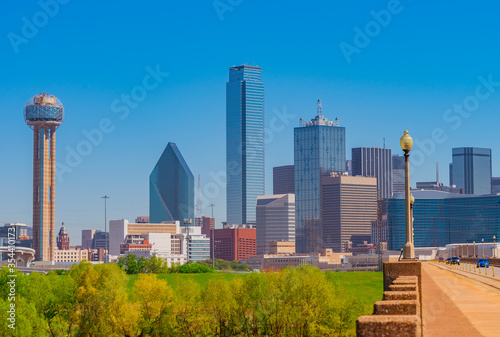 Traffic on a Bridge leads to Dallas skyline in downtown Texas. 